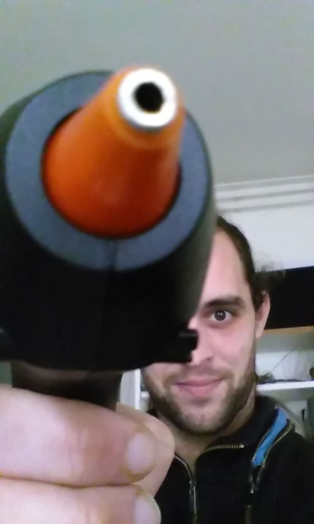 Julien pointing the hot glue gun